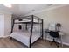 Bedroom with a bunk bed, desk area, and neutral color palette at 3521 Almeria Ave, Sarasota, FL 34239