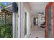 A bright, welcoming entryway with tile flooring and a decorative glass front door at 3521 Almeria Ave, Sarasota, FL 34239
