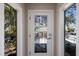 Elegant front door with decorative glass paneling and sidelights at 3521 Almeria Ave, Sarasota, FL 34239