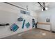 Well-organized garage featuring pegboard walls and built in storage, maximizing space and utility at 3521 Almeria Ave, Sarasota, FL 34239