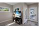 Cozy living room with tile floors, modern windows, and a decorative glass door at 3521 Almeria Ave, Sarasota, FL 34239