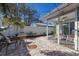 Outdoor patio with dining area and a covered sitting area, creating an inviting space at 3521 Almeria Ave, Sarasota, FL 34239