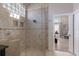 Shower with glass enclosure featuring tile surround and convenient access to the bedroom at 3521 Almeria Ave, Sarasota, FL 34239