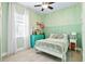 Charming bedroom featuring a bed, a nightstand and a window at 3711 Manorwood Loop, Parrish, FL 34219