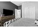 Comfortable bedroom featuring a bed with soccer ball accents and closet doors at 3711 Manorwood Loop, Parrish, FL 34219