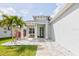 Inviting front porch with seating area and decorative features adding charm to the home's entrance at 3711 Manorwood Loop, Parrish, FL 34219
