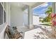 Inviting front porch with seating area offering a relaxing outdoor space at 3711 Manorwood Loop, Parrish, FL 34219