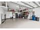 Tidy garage with a refrigerator, shelving, and storage at 3711 Manorwood Loop, Parrish, FL 34219