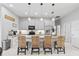 Modern kitchen featuring stainless steel appliances, granite countertops, and bar stool seating at 3711 Manorwood Loop, Parrish, FL 34219