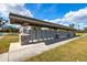 Neighborhood mailboxes sheltered by a large covered structure with stone base and manicured lawn at 3711 Manorwood Loop, Parrish, FL 34219