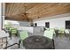 An outdoor kitchen with modern appliances, ceiling fans, and patio tables, great for entertainment at 3711 Manorwood Loop, Parrish, FL 34219