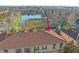 Aerial view of a condo building with a terracotta roof near a lake at 3760 82Nd Avenue E Cir # 101, Sarasota, FL 34243