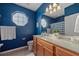 Bright bathroom with a large mirror, unique window, and modern vanity at 3760 82Nd Avenue E Cir # 101, Sarasota, FL 34243