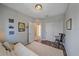 Bedroom features wood floors, closet, and a futon for guests at 3760 82Nd Avenue E Cir # 101, Sarasota, FL 34243