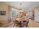 Cozy dining area with natural light and chandelier at 3760 82Nd Avenue E Cir # 101, Sarasota, FL 34243