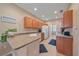 Well-lit kitchen featuring wooden cabinets and tile floors at 3760 82Nd Avenue E Cir # 101, Sarasota, FL 34243