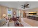Comfortable living room with neutral décor, tile floors and a view at 3760 82Nd Avenue E Cir # 101, Sarasota, FL 34243