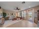 Bright living room featuring tile floors, neutral tones, and natural light at 3760 82Nd Avenue E Cir # 101, Sarasota, FL 34243