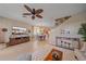 Inviting living room featuring a ceiling fan, entertainment center and tan tile flooring at 3760 82Nd Avenue E Cir # 101, Sarasota, FL 34243