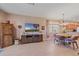 Comfortable living area with wood entertainment center, tile floors, and natural lighting at 3760 82Nd Avenue E Cir # 101, Sarasota, FL 34243