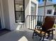 Cozy balcony with a comfortable wicker chair, offering a sunny spot for relaxation at 4440 47Th W Ave # 204, Bradenton, FL 34210