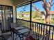 Charming screened balcony overlooking a serene pond and lush landscaping at 4440 47Th W Ave # 204, Bradenton, FL 34210