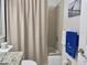 Bathroom with shower/tub combo with tan curtain and vanity with granite countertop at 4440 47Th W Ave # 204, Bradenton, FL 34210