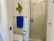 Bathroom featuring a toilet and a glass-doored shower at 4440 47Th W Ave # 204, Bradenton, FL 34210