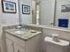 Bathroom featuring a granite countertop vanity, toilet and decorative art at 4440 47Th W Ave # 204, Bradenton, FL 34210