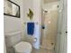 Bathroom featuring a toilet and a glass-doored shower at 4440 47Th W Ave # 204, Bradenton, FL 34210