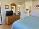 Bedroom with an en-suite bathroom and comfortable sitting area with couch is pictured from bed at 4440 47Th W Ave # 204, Bradenton, FL 34210
