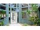 Attractive building exterior with ample windows and lush landscaping surrounding the entrance at 4440 47Th W Ave # 204, Bradenton, FL 34210