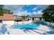 Inviting community pool with ample seating surrounded by a well-maintained deck area at 4440 47Th W Ave # 204, Bradenton, FL 34210