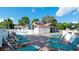 Community pool deck with lounge chairs and covered seating area, ideal for a relaxing day in the sun at 4440 47Th W Ave # 204, Bradenton, FL 34210