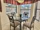 Cozy dining nook with a glass table and lots of bright light from the adjacent windows at 4440 47Th W Ave # 204, Bradenton, FL 34210