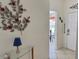 Bright entryway with neutral decor, featuring a glass table and a view into the dining area at 4440 47Th W Ave # 204, Bradenton, FL 34210