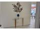 Inviting entryway with tile flooring, decorative table with lamp, and attractive wall decor at 4440 47Th W Ave # 204, Bradenton, FL 34210