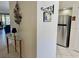 Inviting entryway with a stainless steel refrigerator and artistic decor at 4440 47Th W Ave # 204, Bradenton, FL 34210