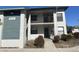 Condo building with visible unit number, a balcony, tidy landscaping, and neutral color scheme at 4440 47Th W Ave # 204, Bradenton, FL 34210
