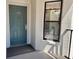 Welcoming condo entrance with a teal door, new lock, and a clean, well-maintained appearance at 4440 47Th W Ave # 204, Bradenton, FL 34210