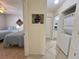 Hallway with a laundry closet and view into bedroom and bathroom at 4440 47Th W Ave # 204, Bradenton, FL 34210