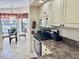 Kitchen featuring stainless steel appliances and cream cabinets, with views into the breakfast nook at 4440 47Th W Ave # 204, Bradenton, FL 34210