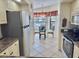 Eat-in kitchen area features a glass table with seating for four and lots of natural light through the window at 4440 47Th W Ave # 204, Bradenton, FL 34210