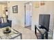 Spacious living room with a glass coffee table and a view of the doorway at 4440 47Th W Ave # 204, Bradenton, FL 34210