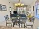 View of a beautifully staged living room and outdoor balcony from dining area pass-through at 4440 47Th W Ave # 204, Bradenton, FL 34210