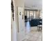 Open living room with tile floors, access to a balcony, and comfortable seating at 4440 47Th W Ave # 204, Bradenton, FL 34210