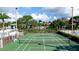 Overhead view of community tennis courts with pool and lush landscaping at 4440 47Th W Ave # 204, Bradenton, FL 34210