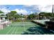 Overhead view of community tennis courts with pool and lush landscaping at 4440 47Th W Ave # 204, Bradenton, FL 34210