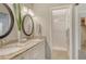 Bathroom vanity boasts double sinks with granite counters, updated vanity, and walk-in shower at 4712 Glenbrooke Dr, Sarasota, FL 34243