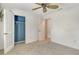 Bedroom features carpeted floor, ceiling fan, closet, and adjoining bathroom at 4712 Glenbrooke Dr, Sarasota, FL 34243